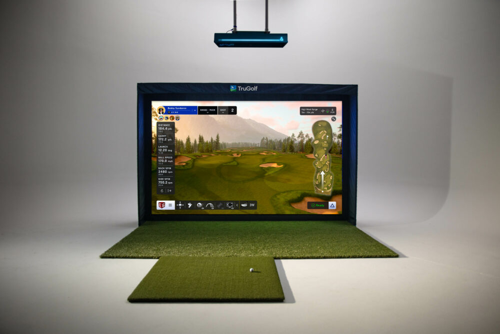 TruGolf MAX 4K golf simulator set up with screen, netting and hitting mat