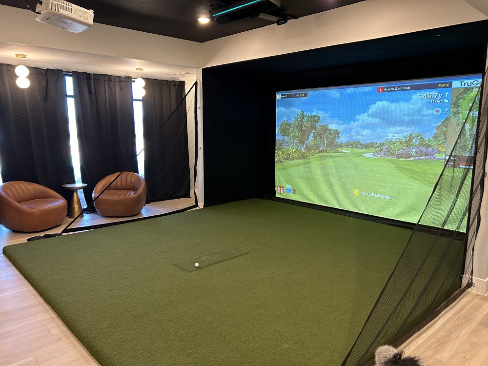 Custom indoor golf simulator installed by 19th Hole Golf Simulators in Austin, TX